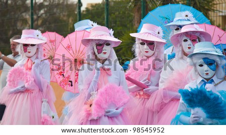 CORRALEJO - MARCH 17: Participants in venetian-style costumes at the assembly point for Grand Carnival Parade, March 17, 2012 in Corralejo, Fuerteventura, Spain