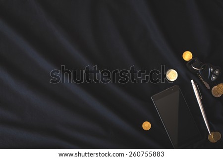 the contents of the pockets of men on a black background