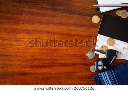 the contents of the pockets of men on a brown wooden table