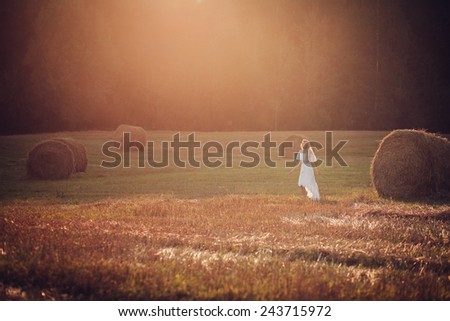 Young woman enjoy with sun in the evening glow