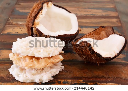Brazilian dessert Coconut candy cocada with coconut on wooden table. Selective focus