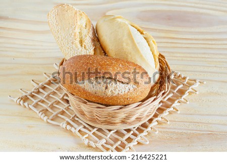 Brazilian french bread, baguette mini with sesame, integral  in wicker basket. Selective focus