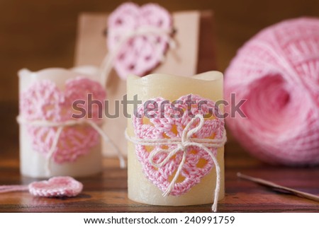 Handmade crochet pink heart for candle and gift package for Saint Valentine\'s day. Selective focus