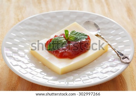 Brazilian dessert Romeo and Juliet, goiabada jam and cheese on wooden table. Selective focus