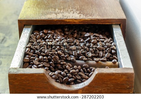 roasted coffee beans, in brown basket soft focus, focus on coffee