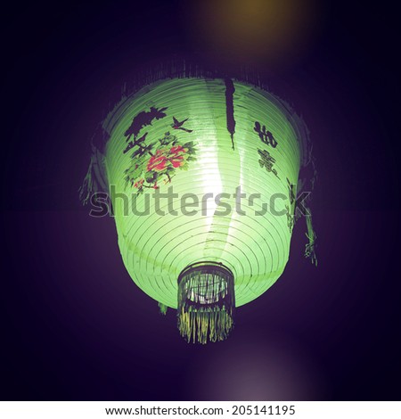 Chinese street lamp - instagram filter. Green round paper lantern - retro filter. Asian market torch. Bodh Gaya, India.