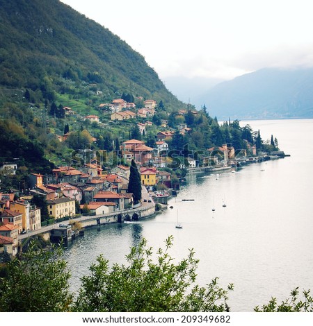 The small town of Varenna at Lake Como - instagram effect. Panoramic view of Varenna town - retro photo filter. City view - vintage colors. Varenna, Lake Como, Italy.