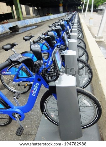 NEW YORK CITY- MAY 24, 2014 - Shared bikes are lined up in the streets of New York City. Citi Bikes, launched in May 2013, has over 330 stations and 6,000 bikes throughout New York City.