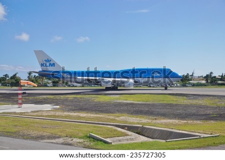 SAINT MARTIN, DUTCH ANTILLES --30 NOVEMBER 2014-- A blue KLM Boeing 747-800 jumbo jet gets ready for take-off at the Princess Juliana International Airport in Saint Martin (Sint Maarten).