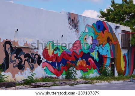 MIAMI, FLORIDA --SEPTEMBER 2014-- Colorful graffiti art line the street walls and back alleys of Miami, Florida, especially in the Wynwood Walls neighborhood.