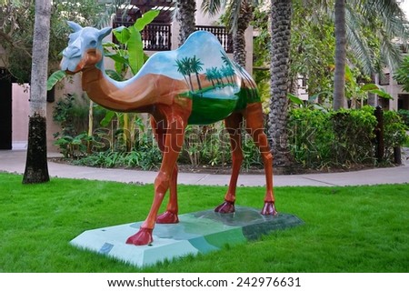 DUBAI, UNITED ARAB EMIRATES --22 DECEMBER 2014-- Statues of dromedary camels with colorful paintings are located throughout the busy city of Dubai in the United Arab Emirates (UAE).