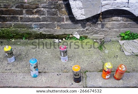 LONDON, ENGLAND -12 MARCH 2015- Editorial: Urban street graffiti artists have left their spray paint dispenser cans in the Old Street, Brick Lane and Shoreditch area in East London.