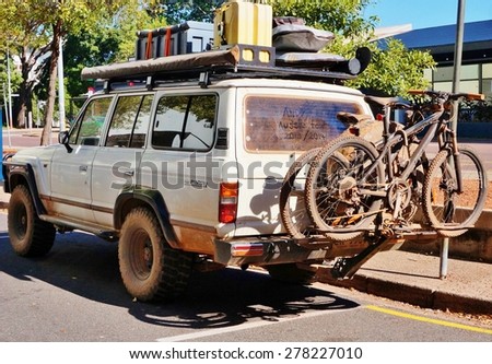 DARWIN, AUSTRALIA -9 AUGUST 2014- A four wheel drive sport utility vehicle is getting ready to cross the Australian outback with spare cans of fuel on the roof.