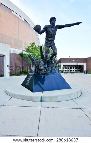 EAST LANSING, MI -22 MAY 2015- A statue of former Spartan basketball star Earvin Magic Johnson stands in front of the entrance to the Breslin Center at Michigan State University (MSU) in East Lansing.