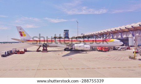 MADRID, SPAIN -5 JUNE 2015- Planes from the Spanish airline Iberia (IB) are lined up at the Adolfo Suarez Madrid Barajas Airport (MAD).