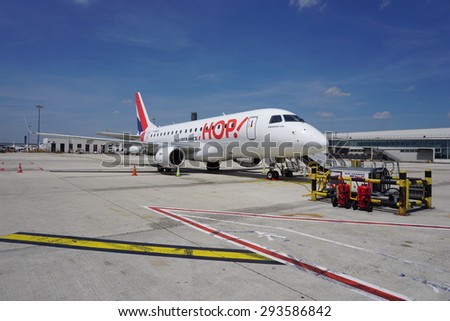 PARIS, FRANCE -13 JUNE 2015- An Embraer 170 jet airplane from the French regional low cost company HOP (A5), a subsidiary of Air France (AF), parked at Roissy Charles de Gaulle airport (CDG)