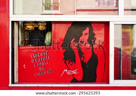PARIS, FRANCE -15 JUNE 2015- Graffiti wall paintings by famous French street artist Miss Tic in the Butte-aux-Cailles neighborhood in the 13th arrondissement of Paris.