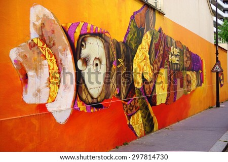 PARIS, FRANCE -18 JUNE 2015- Giant orange painted mural by Chilean street artist INTI in the 13th arrondissement of the French capital.