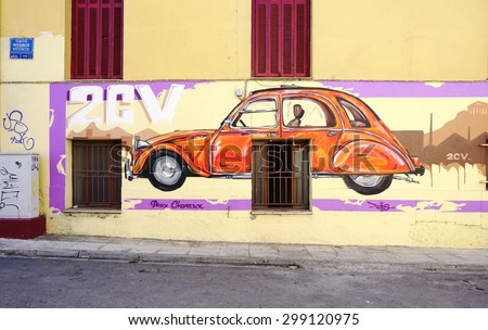 ATHENS, GREECE -14 JULY 2015: Wall paintings of Citroen car on the walls of the building hosting the Citroen Club of Greece in Athens.