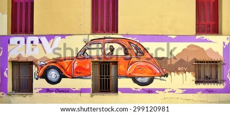 ATHENS, GREECE -14 JULY 2015: Wall painting of Citroen car on the walls of the building hosting the Citroen Club of Greece in Athens.