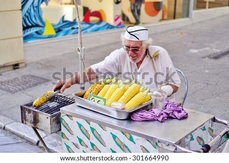 ATHENS, GREECE -14 JULY 2015- Grilled corn on the cob vendor in the street in Athens, Greece.