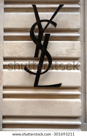 PARIS, FRANCE -8 JULY 2015- Logo of the Yves Saint Laurent fashion house on a wall outside an YSL store in Paris.
