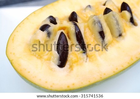 Flesh, pulp and seeds of the common pawpaw fruit (asimina triloba), also called custard apple