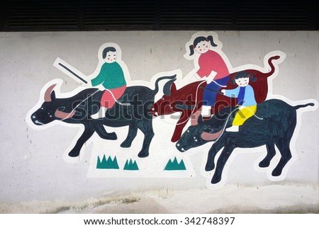 FENGJING, CHINA -15 NOVEMBER 2015- Colored street art wall murals in Xinyi village in Fengjing town near Shanghai. It is a center for Jinshan peasant paintings.