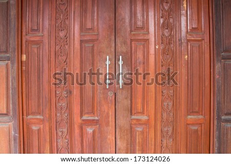 Carved wooden door  Thai design craft door background