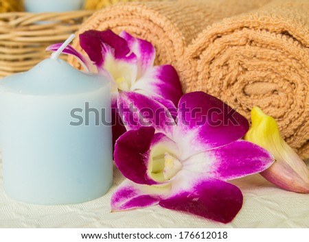 Outdoor spa massage setting at sunset with candle