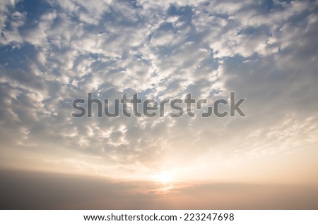 Clouds with blue sky and sun close up