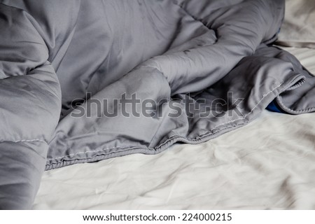 Close up of duvet and messy bedding sheets