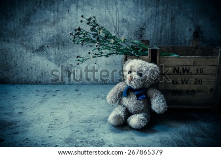 Teddy bear with box in room, Still life vintage effects style,Sad concept