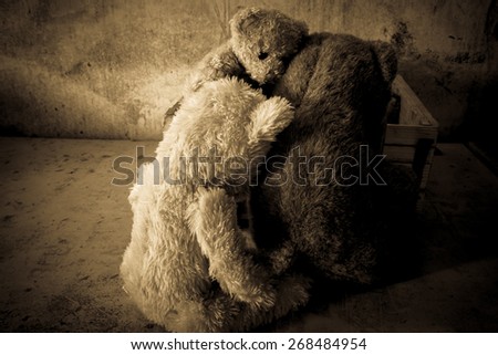 Still life with three teddy bear sad in room,Vintage style filter effects