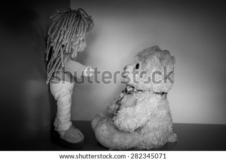 Teddy bear and girl doll  still life ,Black and white