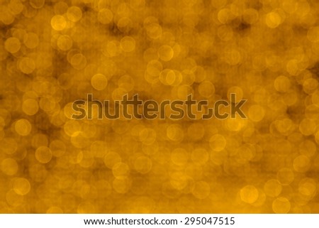 Abstract bokeh background from gold fabric ,sparkle glitter - blurry
