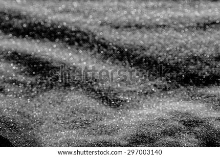 Elegant gold fabric texture background,close up sparkle glitter for design,black and white filter effects
