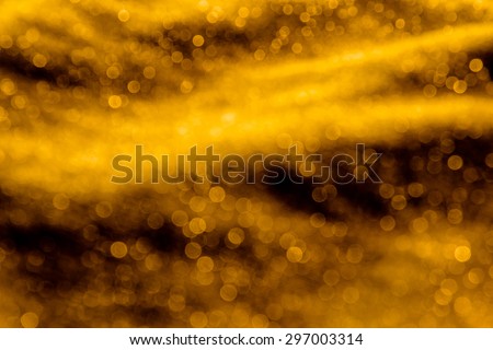 Abstract bokeh background from gold fabric ,sparkle glitter for design
