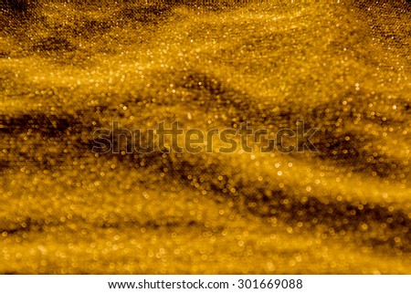 Elegant gold fabric texture background,close up sparkle glitter for design