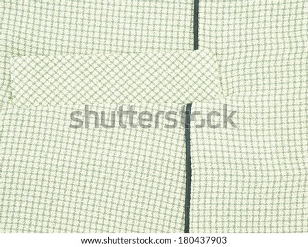 Background of pocket on green shirt textile for woman with square pattern texture.