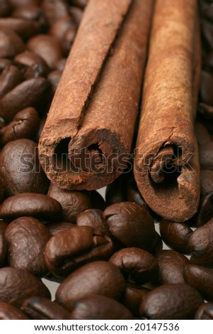 Spice coffee. Coffee beans and cinnamon sticks