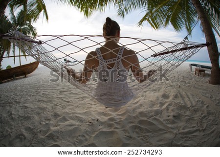 Woman from behind at the hammock