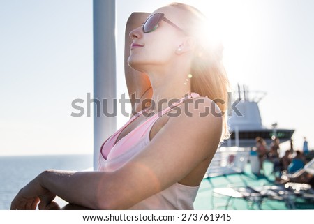 Young day at a ship deck enjoying the sun
