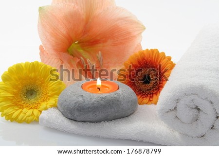 orange and yellow flowers and candle isolated