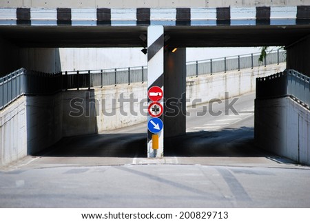 Underpass road with funny signs