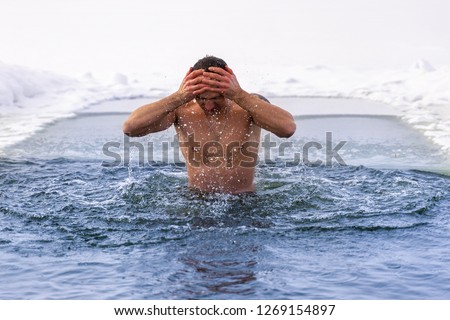 A man who emerged from an ice hole. Ice hole swimming