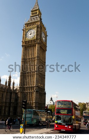 LONDON, UK - OCTOBER 10, 2012: Iconic depiction of the Great Bell clock tower and a typical red bus in the UK
