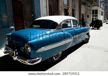 HAVANA, CUBA - June 7, 2015: Classic vintage Chevrolet automobile parked in a narrow street in Old Havana