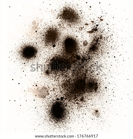 spots of the poured coffee on a white background