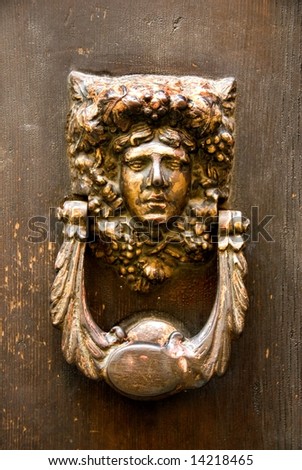 A brown bronze door knocker